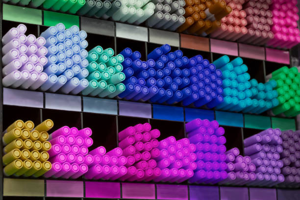 istock Group of multicolored felt-tip pens as school, colledge and university tools on shells. Colorful pencils for drawing and sketching in shop. 1485654974