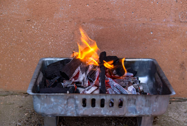 istock Preparation fire and coal for cooking barbecue outdoors 1485656181