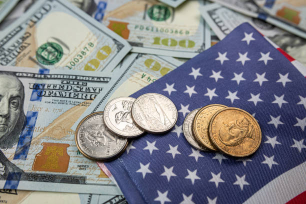 istock American flag with dollar bills banknotes and coin 1485658496