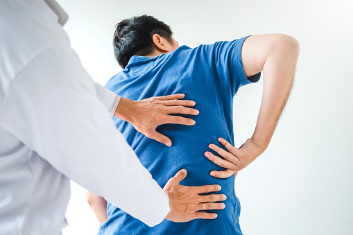Physical Doctor consulting with patient About  muscule pain problems Physical therapy diagnosing concept