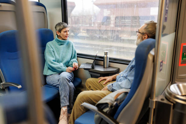 Mature couple traveling by train