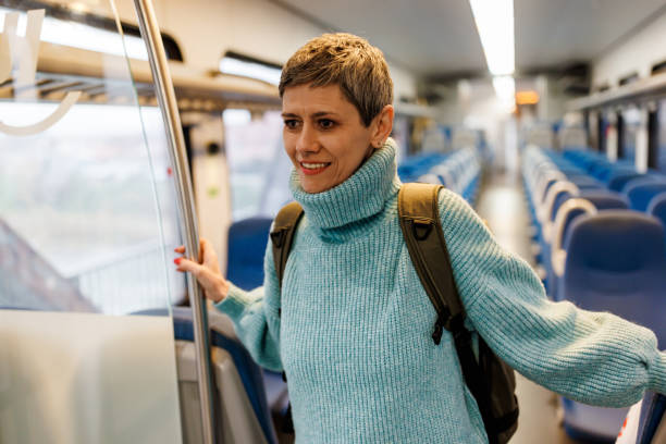 istock One mature woman entering the train 1485665239