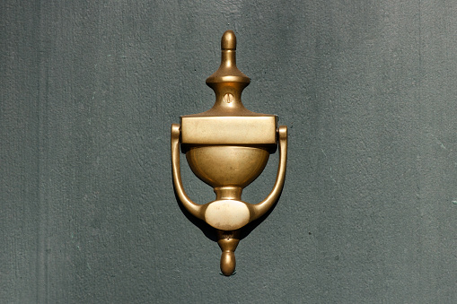 traditional golden door knocker object