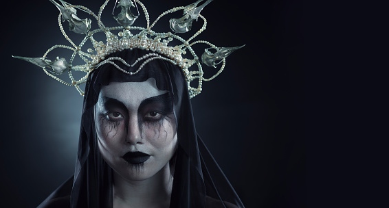 Halloween makeup, woman costume and portrait of grunge Korean cosmetics with grunge royalty aesthetic. Cosplay, goth fashion and Asian model with creative cosmetics and crown in studio with mockup