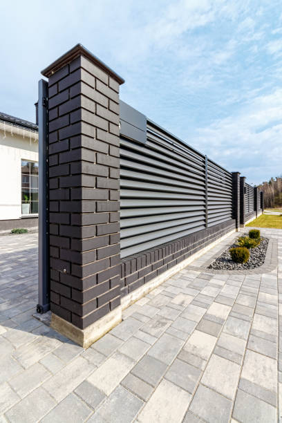 istock Fragment of a modern fence lined with decorative bricks in the old style 1485670769