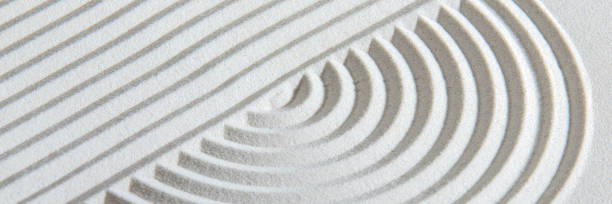 istock Japanese zen garden with stone in textured sand 1485672677
