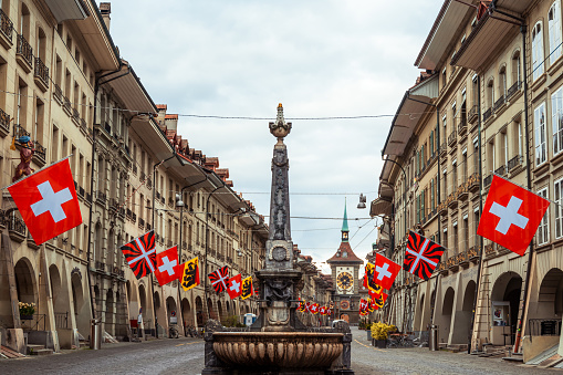 Swiss flags on fasade of the building in Bern city, Switzerland