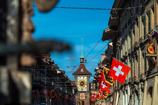 Swiss flag on fasade of the building in Bern city, Switzerland