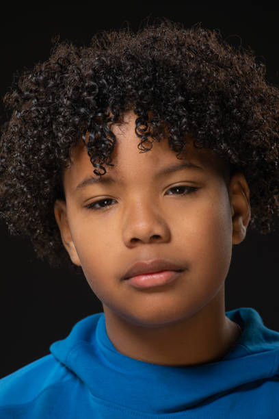 istock Beautiful young black boy posing for studio portrait 1485677101
