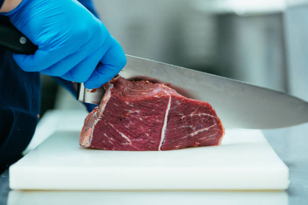 istock Cutting Fresh Raw Beef Red Meat with Knife 1485677692