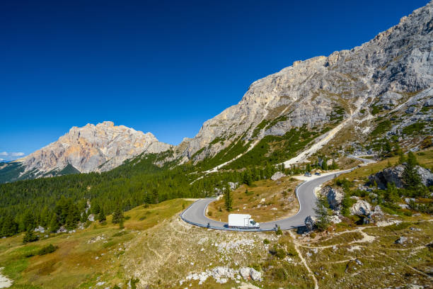 istock Winding mountain road in the dolomites on sunny day 1485680473