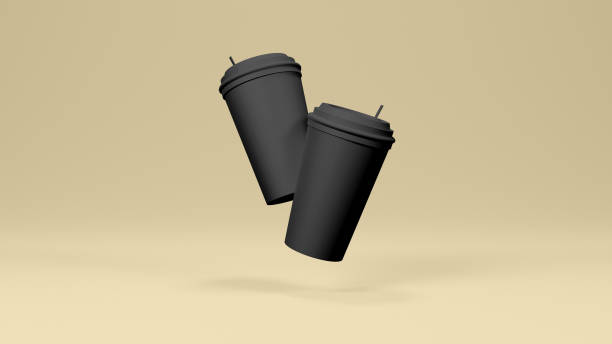 istock Black Colored Hot Coffee Cup in Yellow Background 1485680920