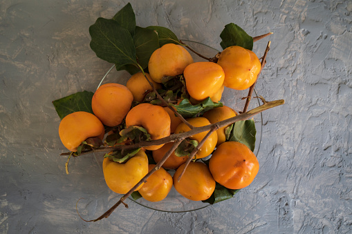 Mandarins and cinnamon on white wooden table