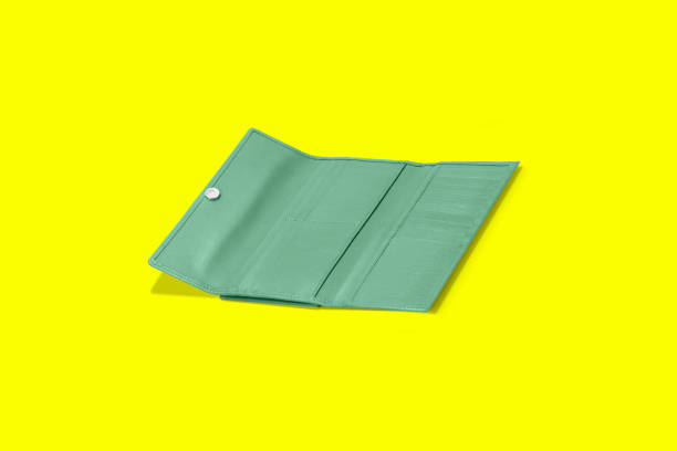 istock Fashionable leather women's wallet on a yellow background. added copy space for text. 1485681064