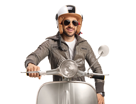 Guy in a leather jacket sitting on a scooter isolated on white background