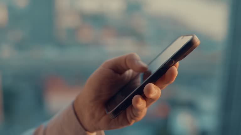 Businessman using smart phone,Close-up
