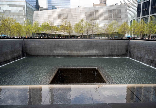 Flowing water of the memorial for the World Trade Center in New York City, erected in memory of those lost on 9/11.