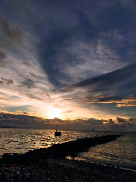 istock sunset that looks beautiful from the pier 1485690290