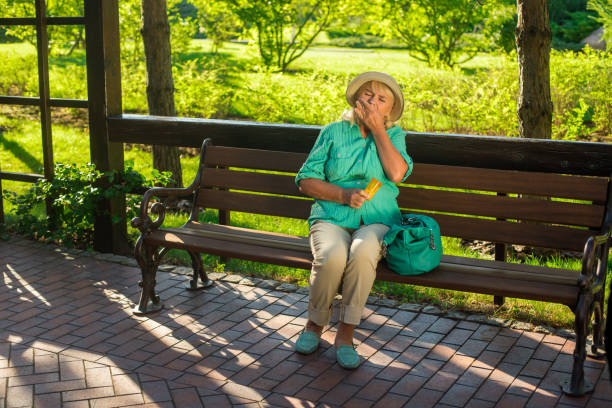 istock Mature woman eating pills. 1485690813