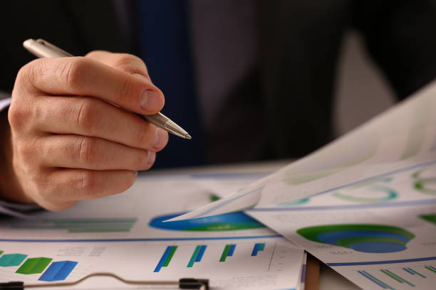 istock Businessman pen pointing at business document for chart and graph data analysis 1485690989