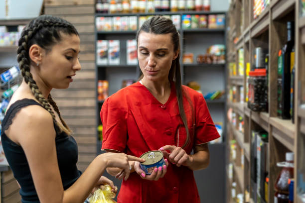 istock An employee in a greengrocer consults a customer. 1485698255