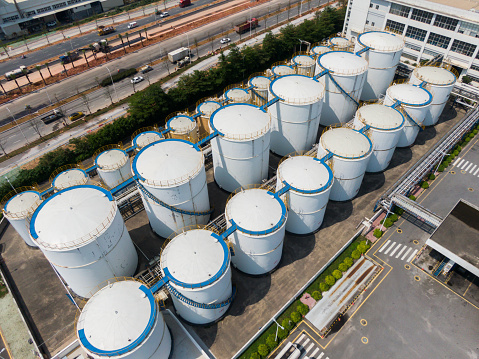 Large white water tank with blue sky