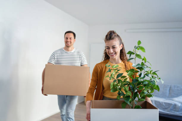 istock Young couple moving in, into their new apartment 1485699572