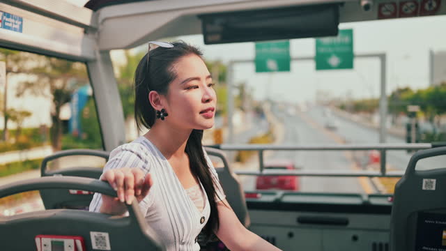 Asian woman tourist on the bus