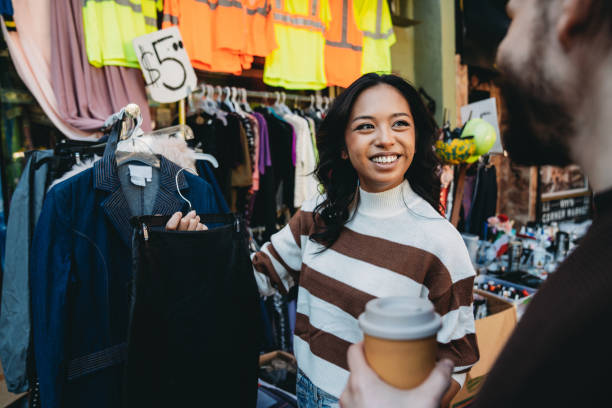 istock A millennial couple is taking a look at a second-hand clothing store 1485704082