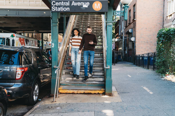 istock A millennial couple is exiting from the elevated train station in Bushwick, Brooklyn 1485704094