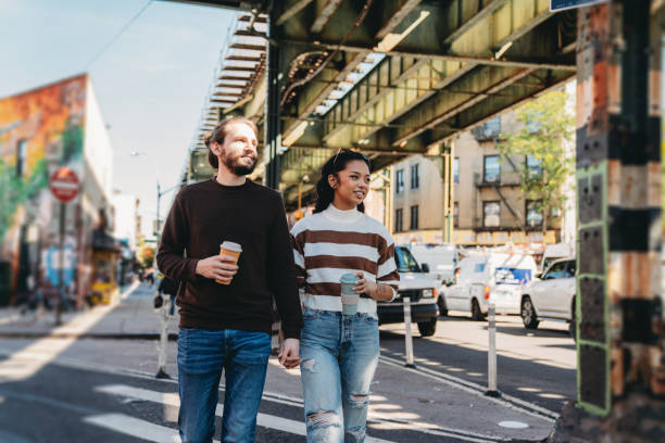 A millennial couple is walking together in Brooklyn