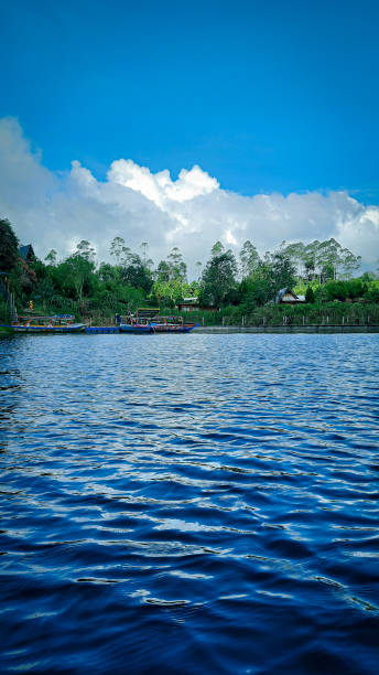 istock Nature's Tranquility: Breathtaking View of a Serene Lake and Lush Greenery 1485708048