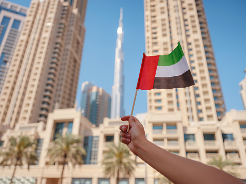 Flag of Kuwait waving in the wind in Kuwait City.