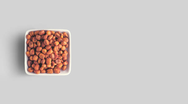 istock Fried salted Mexican corn on the grey background. close up view. 1485712351