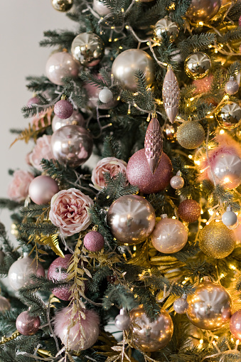 Christmas tree with golden and pink decorations. Cute Christmas decor theme concept