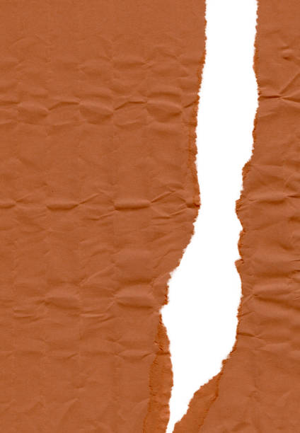 istock Vertical tear on thin cardboard wrapping paper with dented texture 1485713047