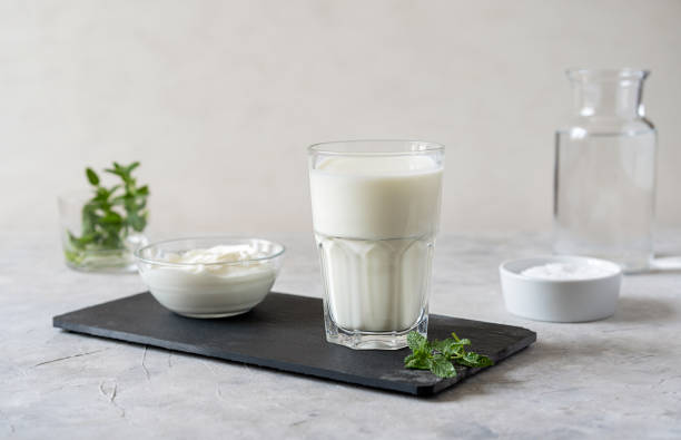 istock Ayran or Doogh is a popular refreshing Middle Eastern beverage made with yogurt, water and salt. Concrete background 1485717307