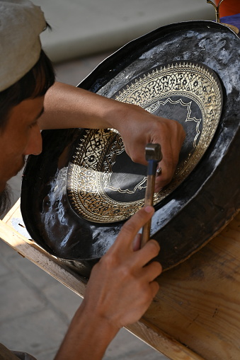 Bukhara, Uzbekistan, April 10, 2023 - Carved pieces feature intricate floral patterns, which sometimes included the name of the artisan who carved them