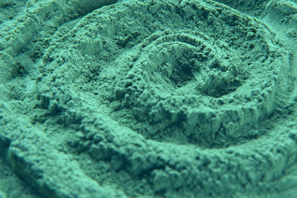 Chlorella or spirulina algae green powder is spinning, rotation. Dietary supplement to improve health. Seaweed superfood. Healthy food background. Vitamins and minerals to diet. Detox. Close up video