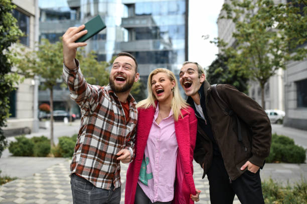 istock Three Friends Taking A Walk And Laughing Through City Center 1485723179