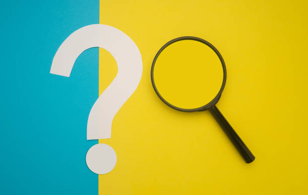 istock A magnifying glass and a question mark symbol are on blue and yellow background. 1485723186
