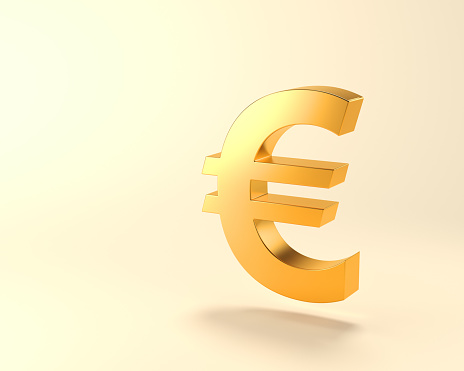 Metallic Gold color European Union Currency Euro symbol standing on light yellow background with copy space. Digitaly generated image.