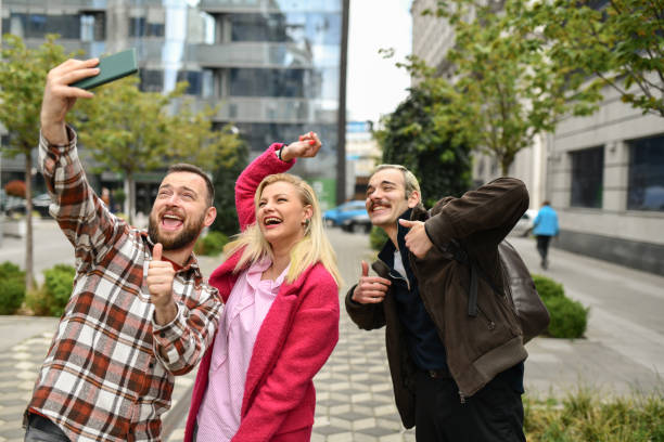 istock Thumbs Up Selfie By Smiling Friends Outside 1485723334