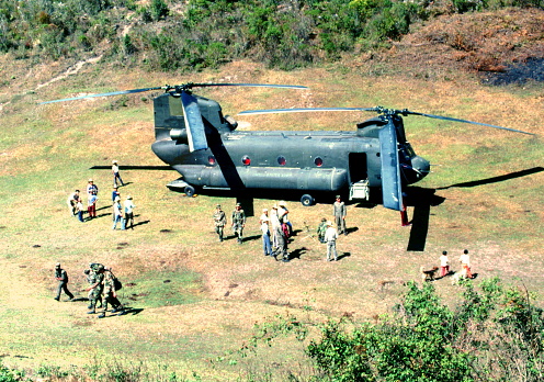 A 101st Airborne Division CH-47D Chinook helicopter out of Soto Cano Air Base in Honduras delivers personnel to a remote mountainous area to conduct a Medical Report mission of the indigenous inhabitants there in mid November 1989.