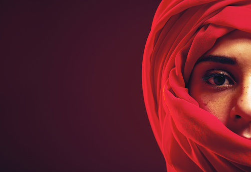 Muslim, eyes and portrait of woman in studio with hijab, mockup and modest beauty on black background. Islamic, face and Arab girl model relax in mysterious, aesthetic and confidence while isolated