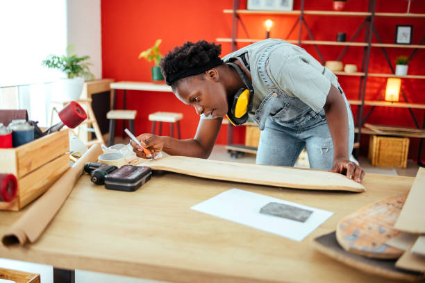 istock Young and hardworking in her skateboard workshop 1485731852