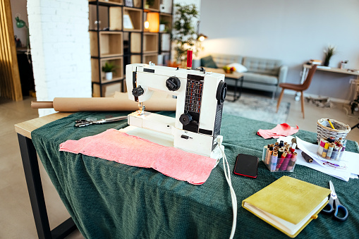 Comfortable home sewing workshop with  equipment and sewing machine