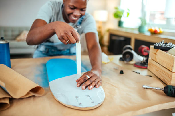 Woman spray painting skate