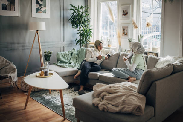 istock Women friends relaxing on sofa 1485738356