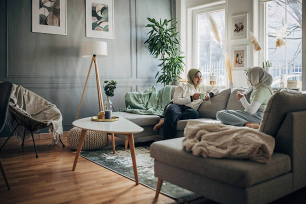 Women friends relaxing on sofa
